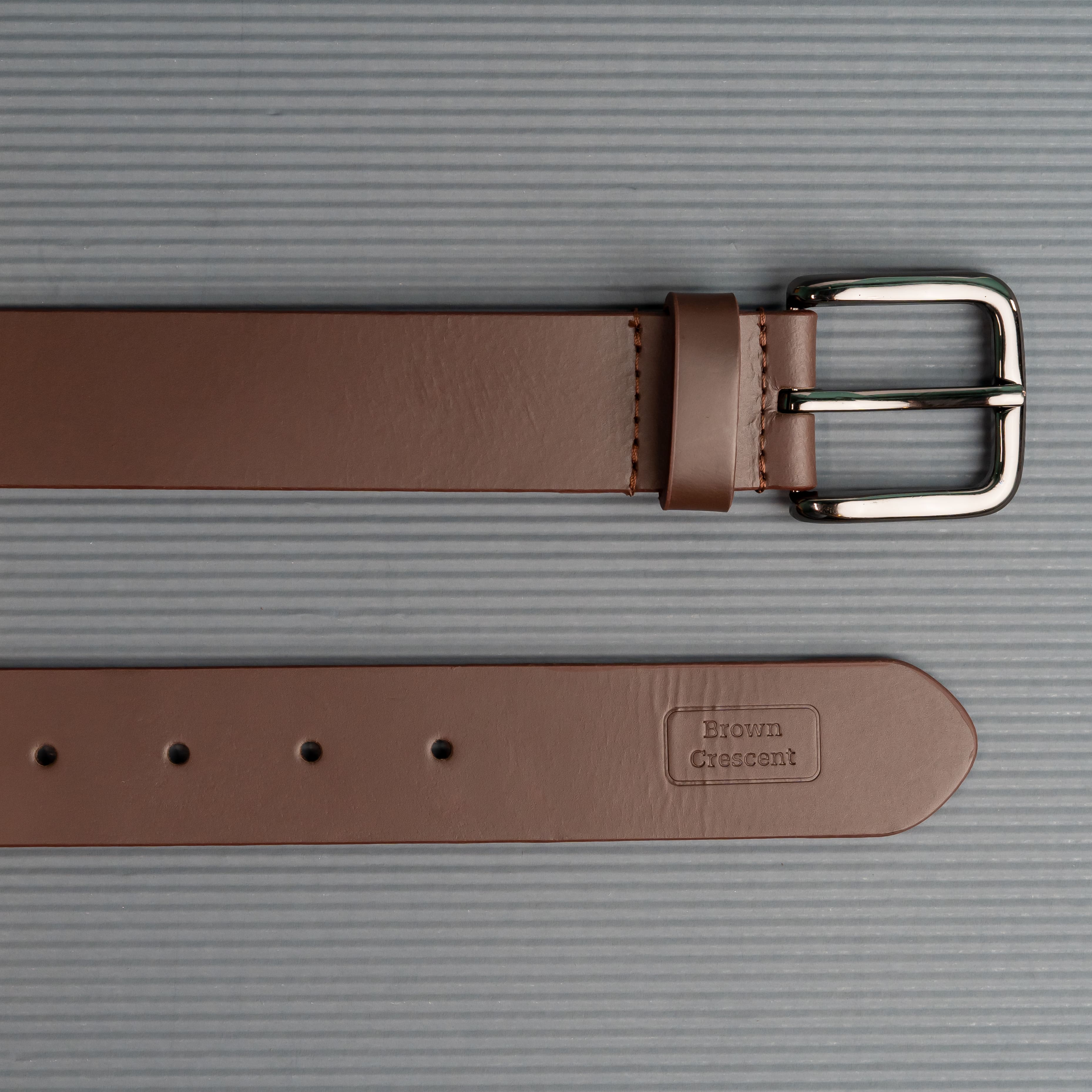 Brown Crescent leather belt showcasing premium craftsmanship and branding details